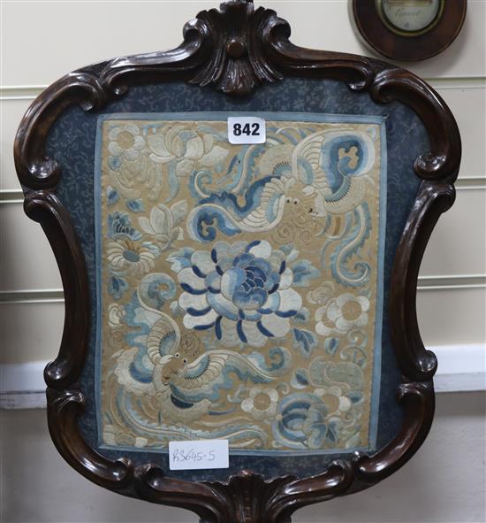 A mahogany carved fire screen with Chinese embroidered panel
